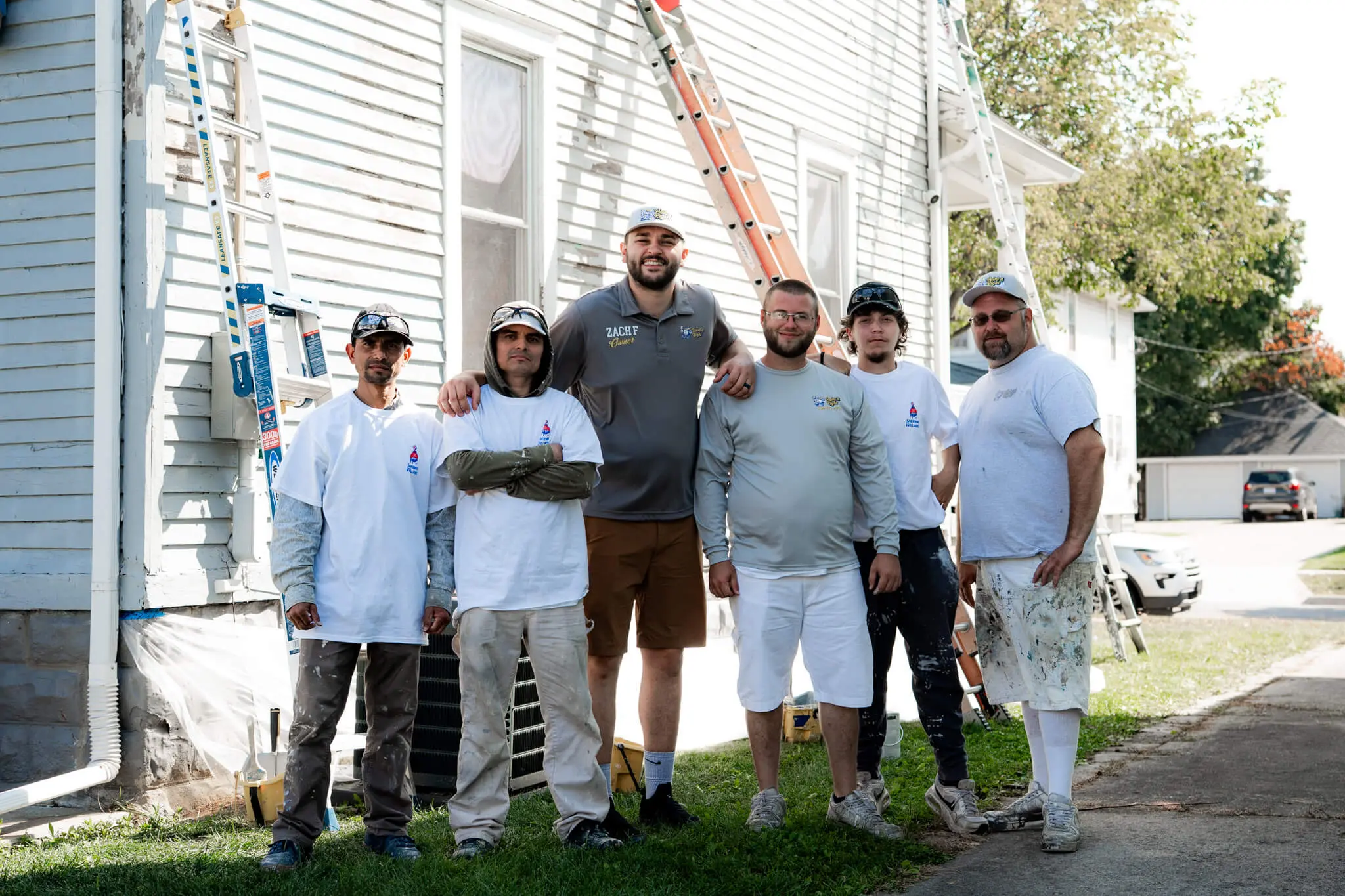 A professional team from Paint It Right standing together on-site, ready to provide expert residential painting services.