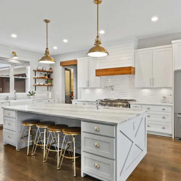 Modern kitchen transformation featuring light grey cabinetry and an elegant marble island, expertly finished by Paint It Right.